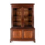 A LOUIS PHILIPPE BURLED MAHOGANY BOOKCASE CABINET, CIRCA 1840s, with a rectangular block form