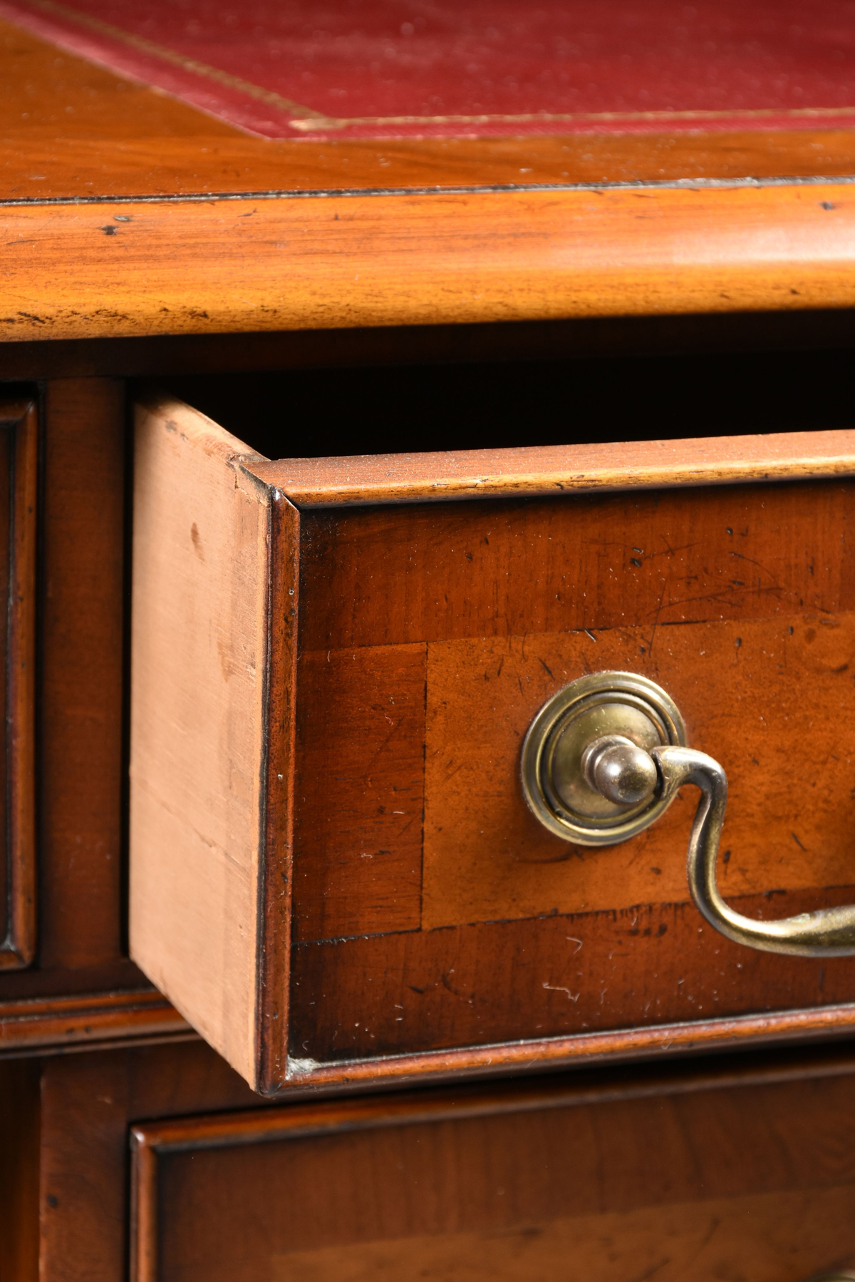 A GEORGE II STYLE WALNUT BURGUNDY LEATHER TOP PARTNER'S DESK, ENGLISH, MID 20TH CENTURY, modeled - Image 5 of 15