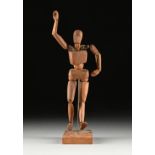 A VINTAGE ARTIST'S CARVED WOOD ARTICULATED FIGURE ON STAND, FIRST HALF 20TH CENTURY, carved hardwood