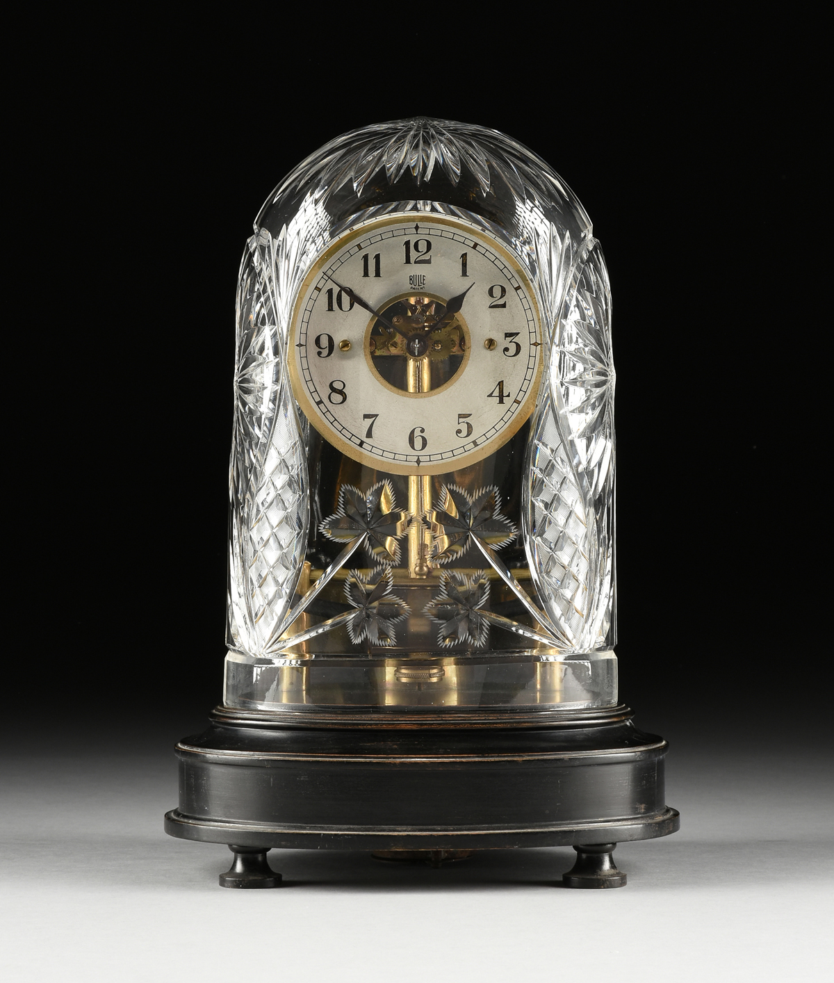 A ELECTROMAGNETIC BRASS SKELETON CLOCK, BY BULLE, FRENCH, NUMBERED, EARLY 20TH CENTURY, the silvered