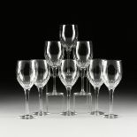 A SET OF EIGHT CUT CRYSTAL WINE GLASSES, MODERN, the petal cut cup on an elegant stem ending on a