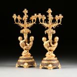 A PAIR OF PALATIAL LOUIS XV STYLE GILT BRONZE AND GRANITE SEVEN LIGHT FIGURAL CANDELABRAS, 20TH