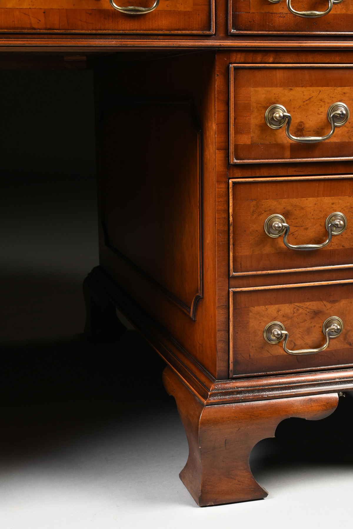 A GEORGE II STYLE WALNUT BURGUNDY LEATHER TOP PARTNER'S DESK, ENGLISH, MID 20TH CENTURY, modeled - Image 12 of 15