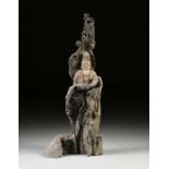 A LARGE CHINESE CARVED TREE TRUNK BUST OF GUANYIN, 20TH CENTURY, sculpted within a natural tree