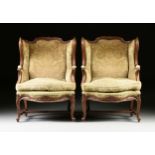 A PAIR OF LOUIS XV STYLE UPHOLSTERED AND CARVED WALNUT BERGÉRES A LA OREILLES, THIRD QUARTER 20TH