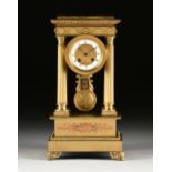 A CHARLES X STYLE GILT LACQUERED METAL PORTICO CLOCK, LATE 19TH CENTURY, the stepped rectangular