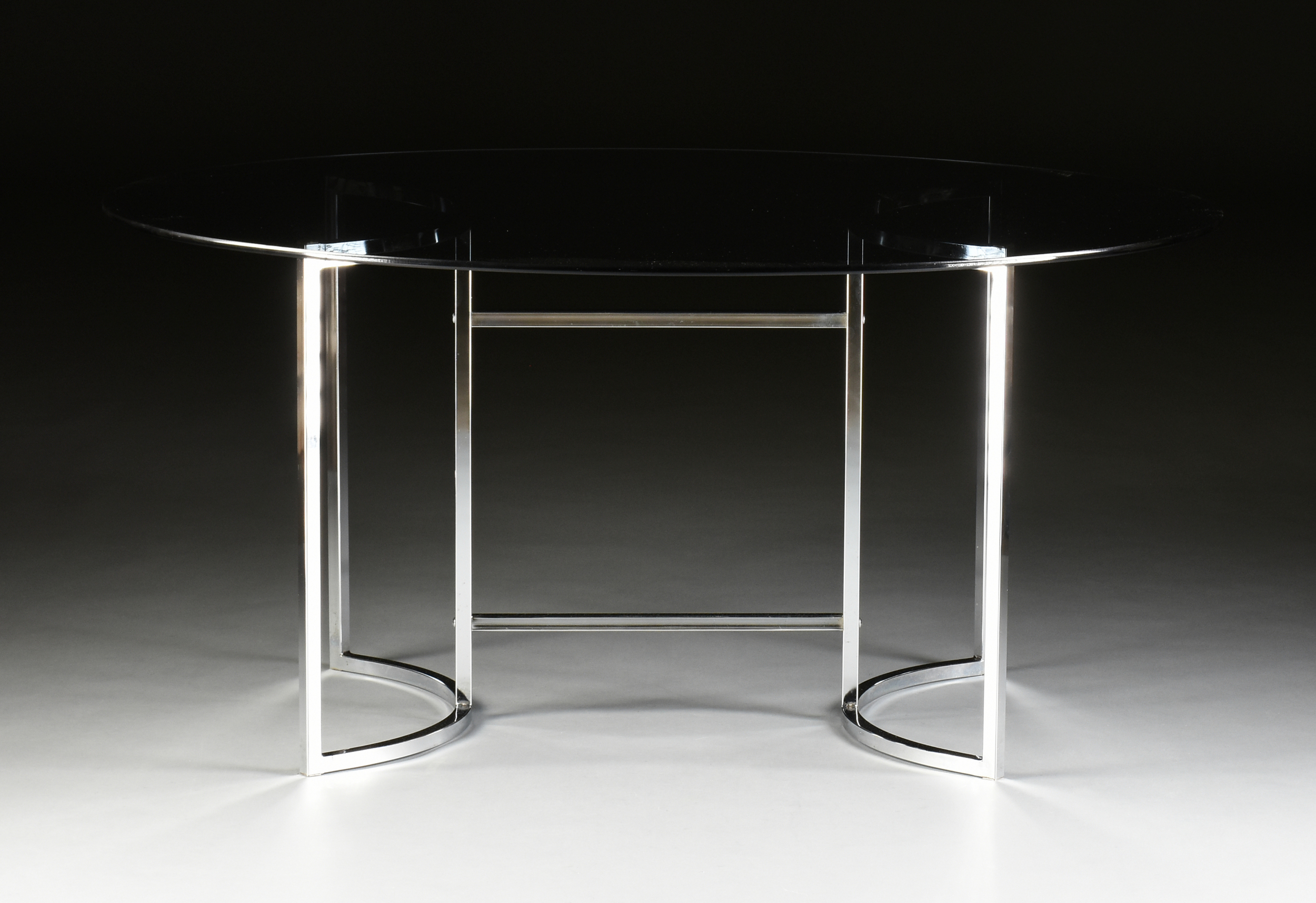 A MID CENTURY MODERN SMOKEY GLASS TOP CHROMED STEEL TABLE, AFTER MILO BAUGHMAN, MID/LATE 20TH