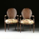 A PAIR OF LOUIS XVI STYLE CANE BACK AND UPHOLSTERED STAINED WOOD FAUTEUILS, 20TH CENTURY, each