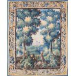 A BRUSSELS BAROQUE VERDURE TAPESTRY, 17TH CENTURY, of rectangular form and depicting blossoming