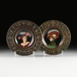 A PAIR OF RENAISSANCE REVIVAL ENAMELED PORCELAIN PLATES WITH REPOUSSÉ BORDER, PROBABLY ITALIAN,