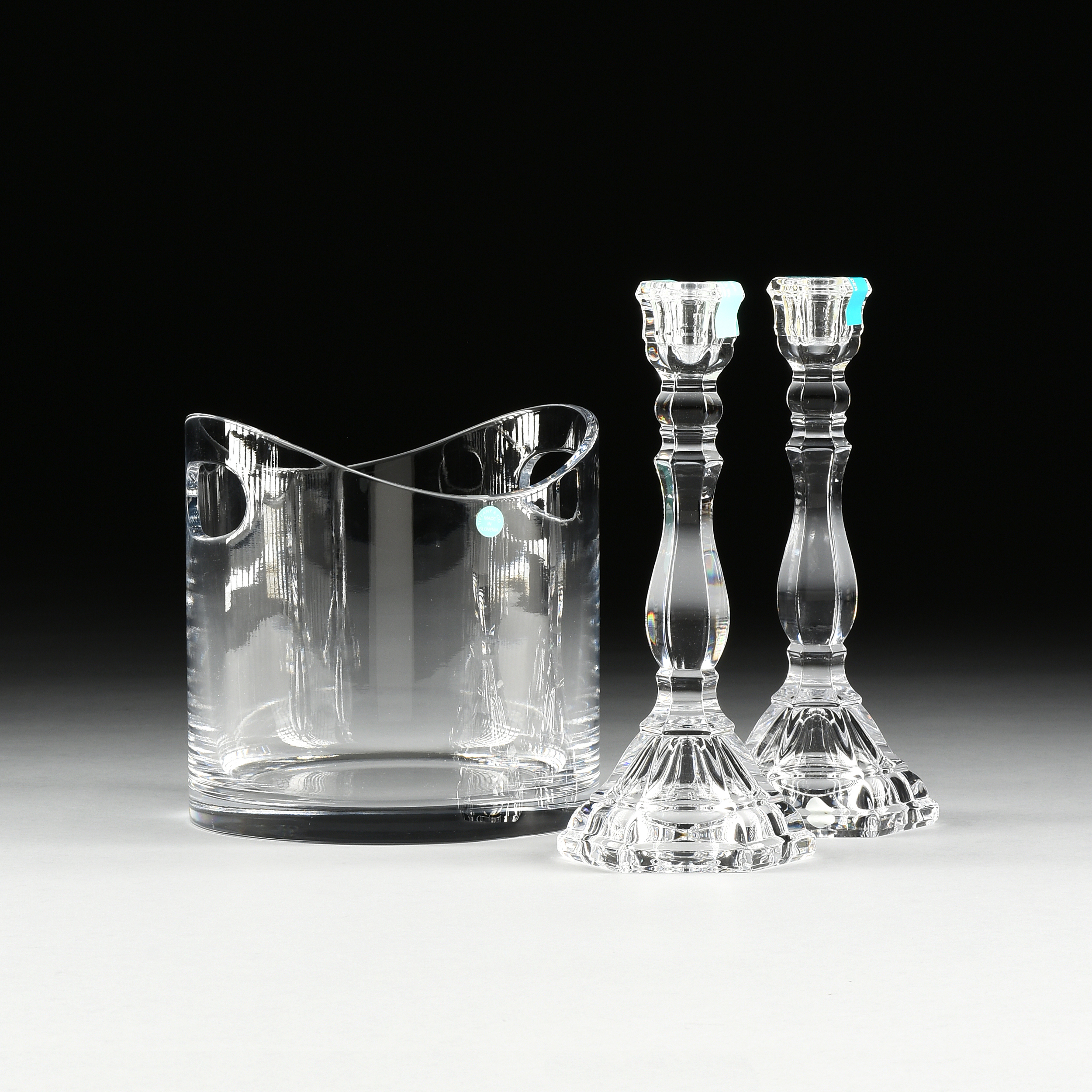 A PAIR OF TIFFANY & CO. CRYSTAL "HAMPTON" CANDLESTICKS AND A TIFFANY & CO CRYSTAL ICE BUCKET,