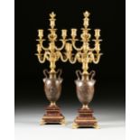 A PAIR OF FRENCH NEOCLASSICAL STYLE GILT AND PATINATED BRONZE SEVEN LIGHT CANDELABRA, BY FERDINAND