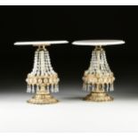 A PAIR OF ITALIAN HOLLYWOOD REGENCY STYLE MARBLE TOPPED AND CUT CRYSTAL MOUNTED GILT METAL TABLE