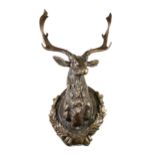 A LOUIS XIV STYLE PATINATED BRONZE MODEL OF A TROPHY STAG HEAD MOUNT, AFTER THE ORIGINAL IN THE STAG