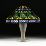 AN UNUSUAL BRADLEY & HUBBARD PATINATED METAL OVERLAY AND SLAG GLASS LAMP SHADE WITH HANDEL METAL