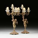 A PAIR OF FRENCH GILT BRONZE SEVEN LIGHT FIGURAL CANDELABRA, 20TH CENTURY, each cast as a cloth