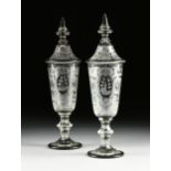 A PAIR OF BOHEMIAN CUT AND ETCHED LIDDED GLASS VASES, LATE 19TH/EARLY 20TH CENTURY, each with a