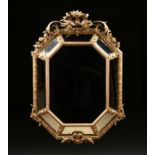 A REGENCE STYLE PARCEL GILT AND CARVED WOOD OCTAGONAL MIRROR, SECOND HALF 19TH CENTURY, centering an