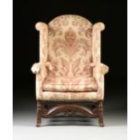 A WILLIAM AND MARY CARVED OAK AND UPHOLSTERED WINGBACK ARMCHAIR, 17TH/18TH CENTURY, the arched