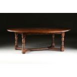 A LARGE CHARLES II STYLE CARVED OAK AND ELM BREAKFAST TABLE, LATE 20TH CENTURY, the thick oval and