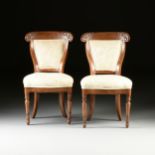 A SET OF THREE LOUIS PHILIPPE CARVED WALNUT SIDE CHAIRS, LATE 1840s, each with an arched crest rail