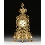 A BAROQUE REVIVAL GILT BRASS MANTEL CLOCK, PROBABLY ENGLISH, EARLY 20TH CENTURY, a sprouting dual