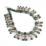 A NAVAJO STYLE TRIBAL SILVER AND MALACHITE SQUASH BLOSSOM NECKLACE, 20TH CENTURY, round malachite