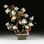 A CHINESE CARVED JADE AND HARDSTONES BLOSSOMING TREE, MODERN, with each flower bloom composed of