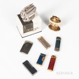 Eight Lighters, a Ronson "Queen Anne" in original box; three enameled and metal Dunhills; a Bugatti;
