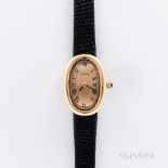 Cartier 18kt Gold Baignoire Wristwatch, arched gilt roman numeral dial with black stick hands, Carti