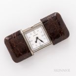 Movado "Ermeto" or Purse Clock, c. 1930s, leather-bound sliding case opens to the enameled numeral d