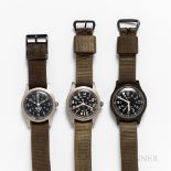 Three Military Wristwatches, green plastic molded Timex with black dial and lollipop sweep center se