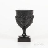 Humphrey Palmer Black Basalt Goblet, England, c. 1775, molded cup with four faces below a heart-shap