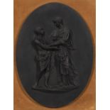 Oval Black Basalt Plaque, England, late 18th/early 19th century, high relief depiction of Papyrius a