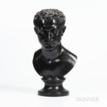 Wedgwood & Bentley Black Basalt Bust of Cato, England, c. 1775, mounted atop a waisted circular socl