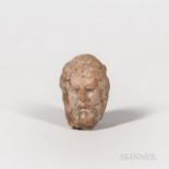 Ancient Greek Terra-cotta Fragment, early 4th century B.C., depicting a bearded man's head, probably