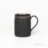 Silver-mounted Wedgwood Black Basalt Tankard, England, c. 1800, cylindrical shape with a wide oak le