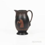 Wedgwood Encaustic Decorated Black Basalt Pitcher, England, early 19th century, oval shape with mask