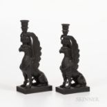 Two Wedgwood Black Basalt Griffin Candlesticks, England, late 19th century, each modeled seated and