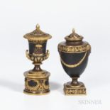 Two Wedgwood Gilded and Bronzed Black Basalt Vases and Covers, England, c. 1885, one with laurel fes