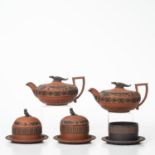 Five Wedgwood Egyptian Items, England, early 19th century, four in rosso antico with applied black b
