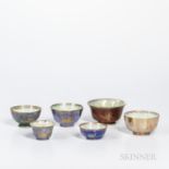 Six Wedgwood Lustre Bowls, England, c. 1920, a bowl with gilt butterflies to a mottled wine red exte