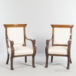 Pair of Italian Walnut Armchairs, each hand rest carved with the head of Bacchus terminating in hoof