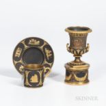 Two Wedgwood Gilded Black Basalt Items, England, c. 1885, a coffee can and saucer with classical fig