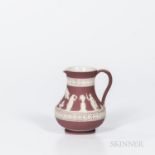 Wedgwood Crimson Jasper Dip Etruscan Jug, England, early 20th century, applied white classical figur