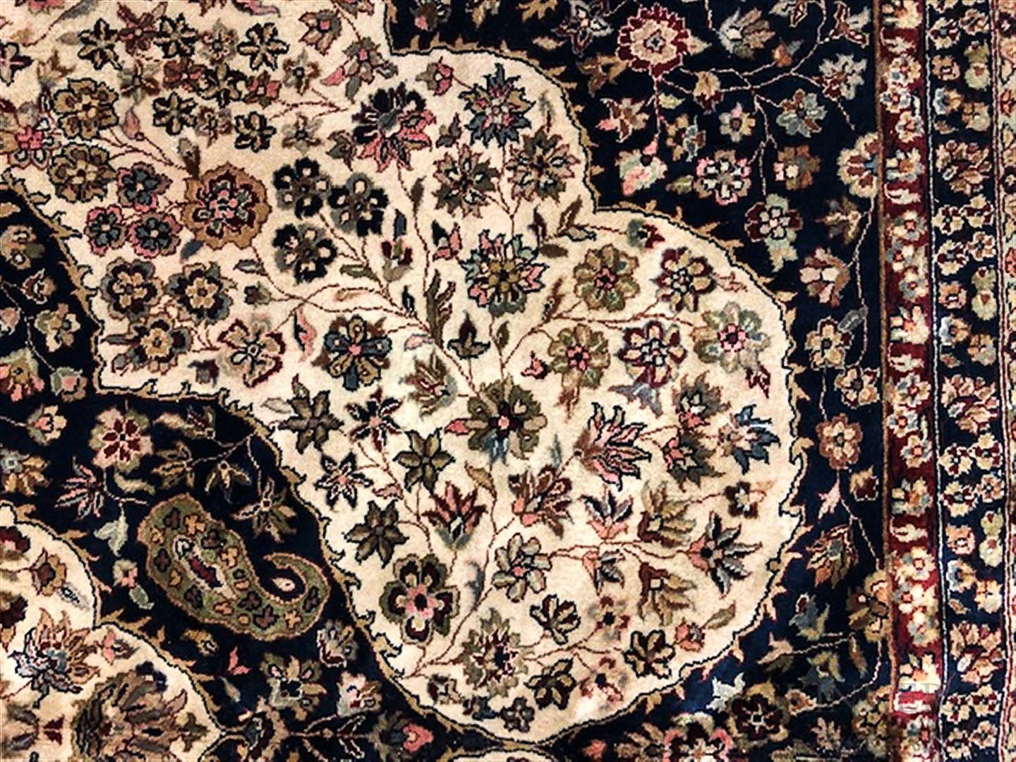 Tabriz Carpet, Iran, c. 1980, featuring stylized tendrils, leaves, and blossoms on a dark blue field - Image 2 of 3