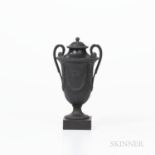 Wedgwood & Bentley Black Basalt Vase and Cover, England, c. 1780, foliate molded loop handles, urn s