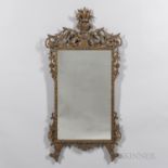 Giltwood Mirror, 19th century, with a floral crest and scrolled apron, ht. 49 1/2, wd. 26 in.
