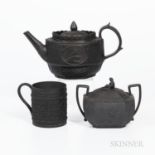 Three Wedgwood Black Basalt Items, England, 19th century, cylindrical mug with wide oak leaf band, h