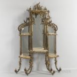Bronze and Onyx Mirrored Etagere, with a rocaille scrolled frame supporting five shelves, ht. 64, wd